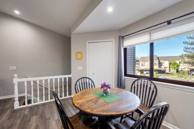 dining space featuring wood finished floors, baseboards, and recessed lighting