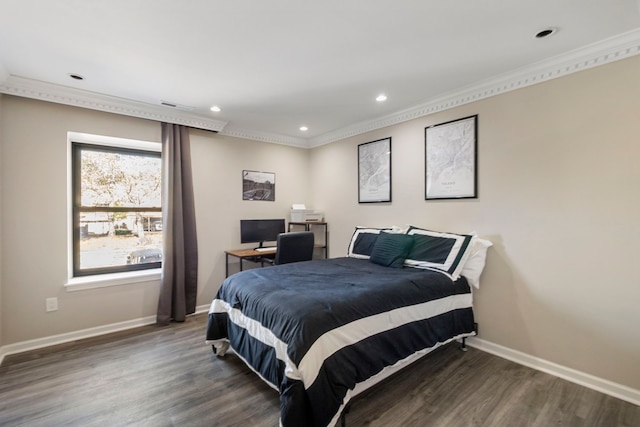 bedroom with ornamental molding, baseboards, recessed lighting, and wood finished floors