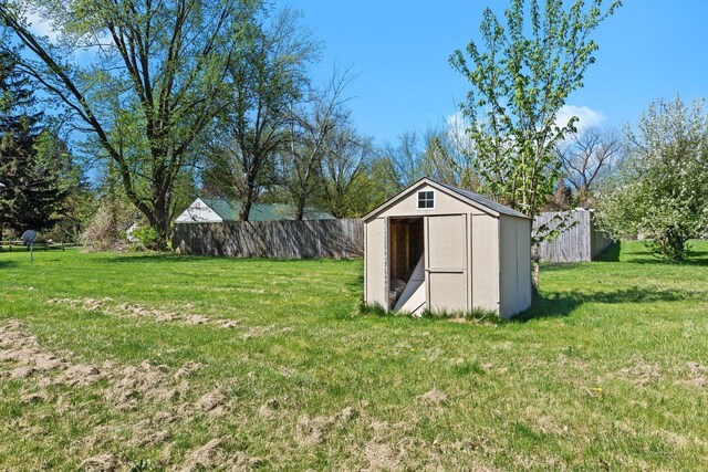 view of shed with fence