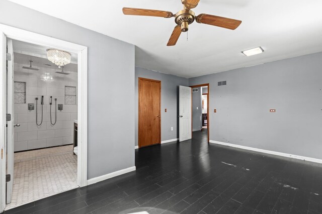 unfurnished room with baseboards, a ceiling fan, and visible vents