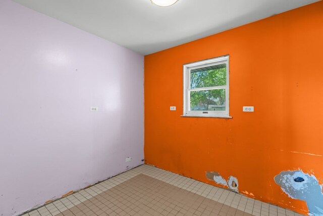 view of tiled spare room