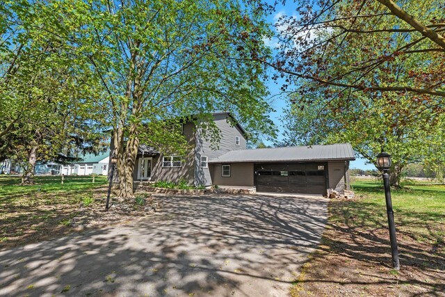view of front of property featuring a garage and driveway