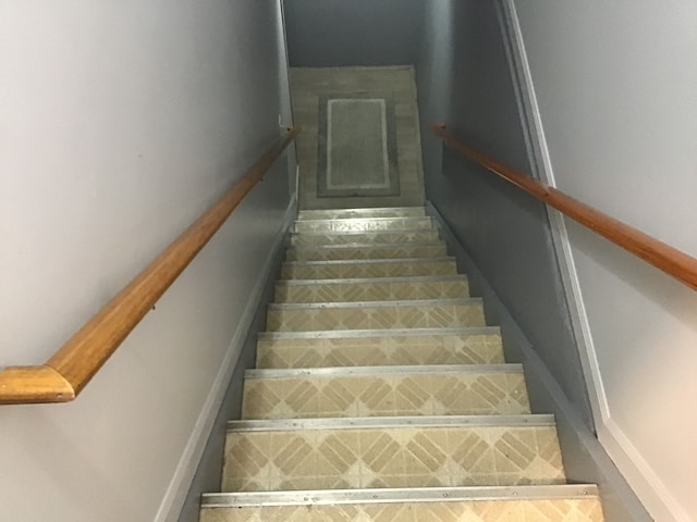 stairs featuring baseboards