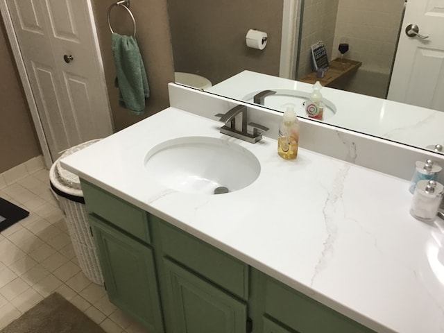 bathroom featuring vanity and tile patterned flooring
