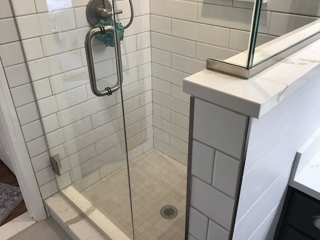 bathroom featuring a shower stall