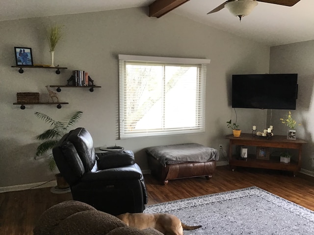 living room with a ceiling fan, lofted ceiling with beams, and wood finished floors