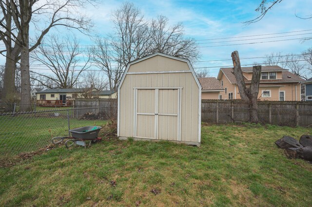 view of shed with a fenced backyard