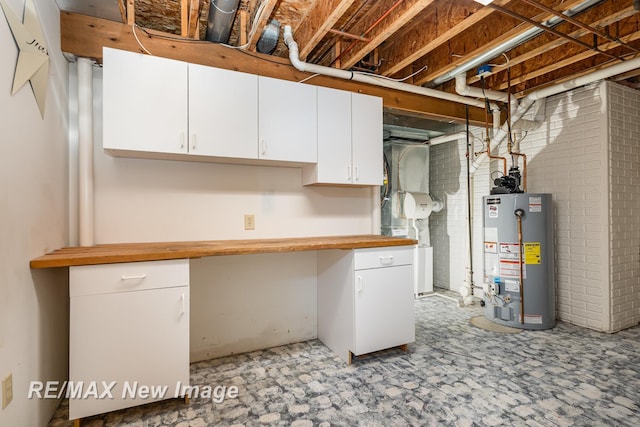 unfinished basement with water heater