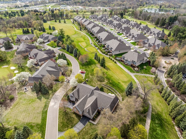 birds eye view of property with a residential view, a water view, and golf course view
