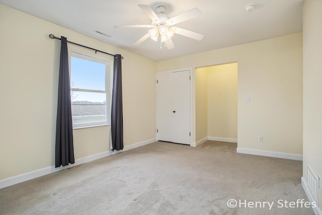 1355 Middle Ln, Battle Creek, MI 49014 - unfurnished bedroom with light colored carpet and a ceiling fan