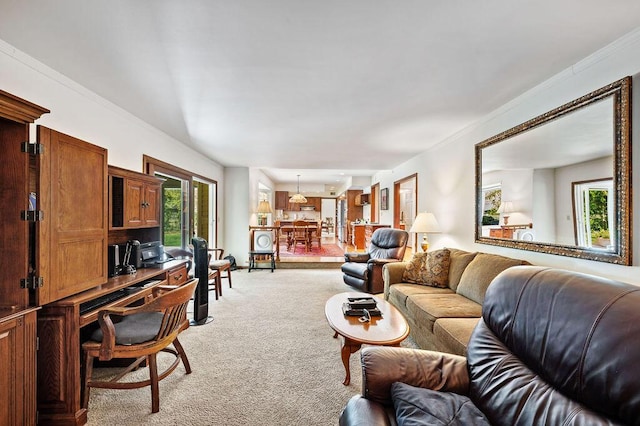 living area with ornamental molding and light carpet