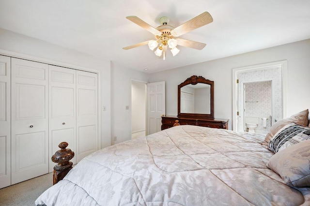 bedroom with a closet, a ceiling fan, carpet floors, and ensuite bathroom
