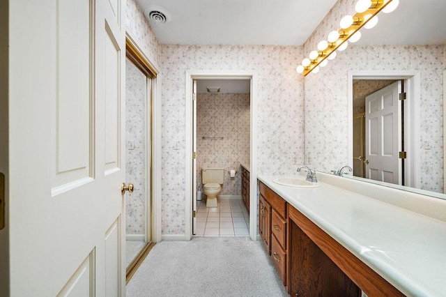 full bathroom with vanity, visible vents, and wallpapered walls