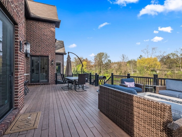 wooden terrace featuring outdoor dining area and an outdoor living space