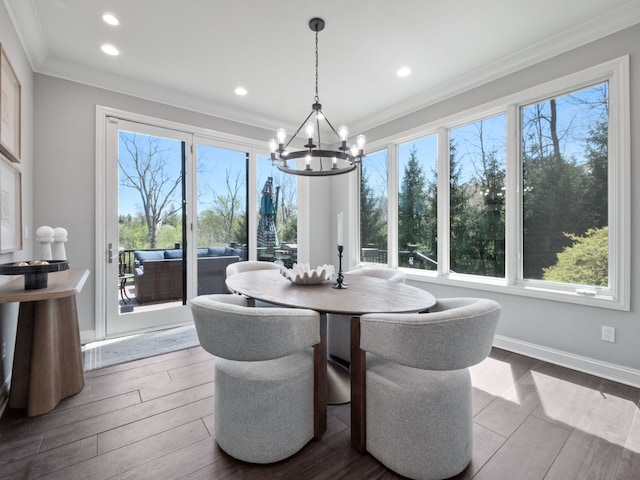 dining space with recessed lighting, a chandelier, ornamental molding, and a wealth of natural light