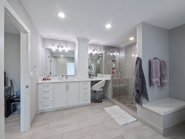 bathroom featuring recessed lighting, baseboards, a shower stall, and vanity
