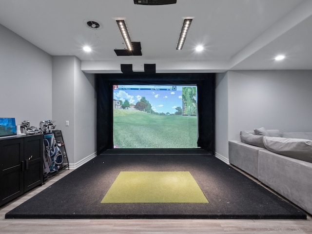 playroom with baseboards, recessed lighting, and golf simulator