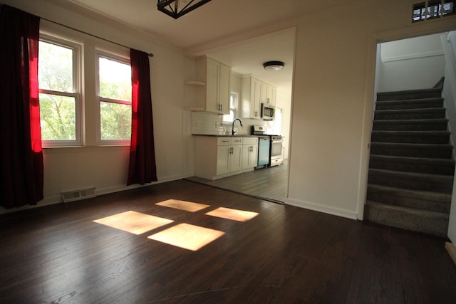 1068 La Salle Ave, Waterford, MI 48328 - unfurnished living room featuring a sink, dark wood-type flooring, and visible vents