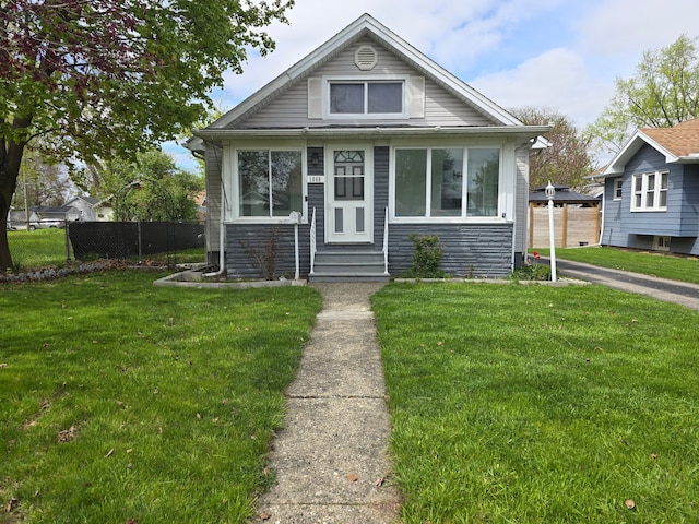 1068 La Salle Ave, Waterford, MI 48328 - bungalow-style house featuring a front lawn, fence, and entry steps