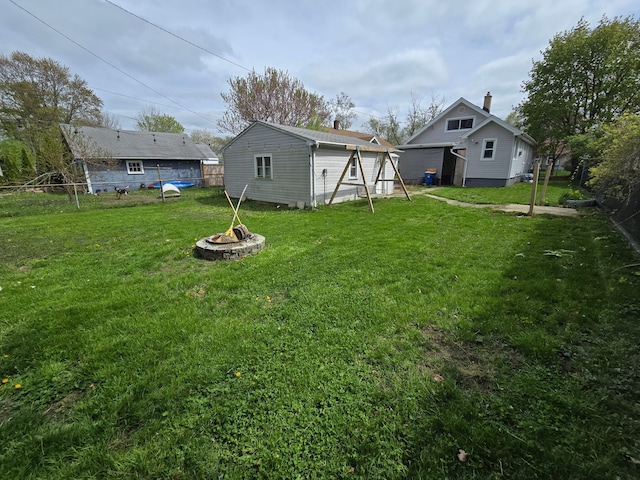 1068 La Salle Ave, Waterford, MI 48328 - view of yard with an outdoor structure, a fire pit, and fence