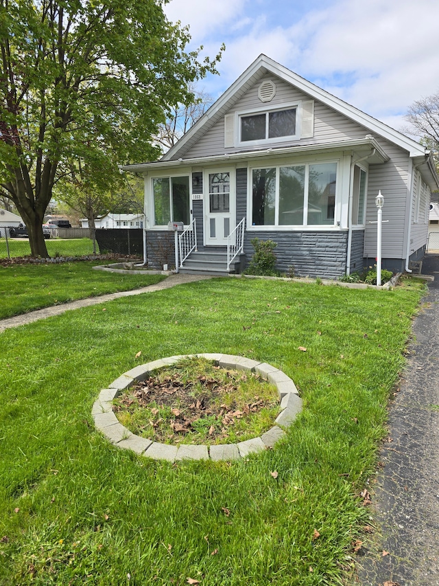 1068 La Salle Ave, Waterford, MI 48328 - bungalow-style house with entry steps, stone siding, and a front yard