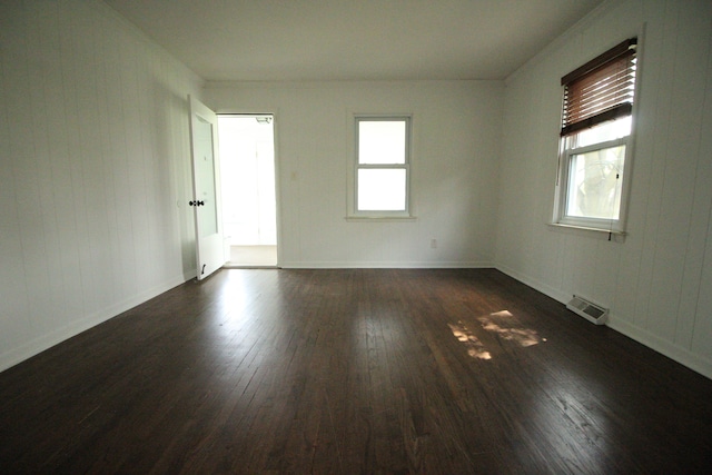 1068 La Salle Ave, Waterford, MI 48328 - unfurnished room featuring a healthy amount of sunlight, baseboards, dark wood-style floors, and visible vents