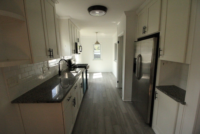 1068 La Salle Ave, Waterford, MI 48328 - kitchen with a sink, tasteful backsplash, dark wood-type flooring, white cabinetry, and appliances with stainless steel finishes