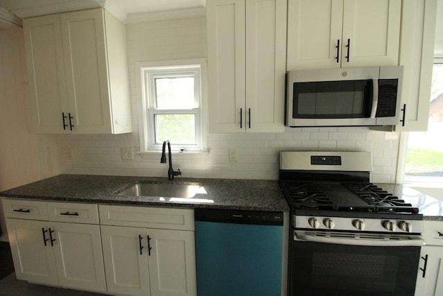 1068 La Salle Ave, Waterford, MI 48328 - kitchen featuring a sink, stainless steel appliances, white cabinetry, and decorative backsplash