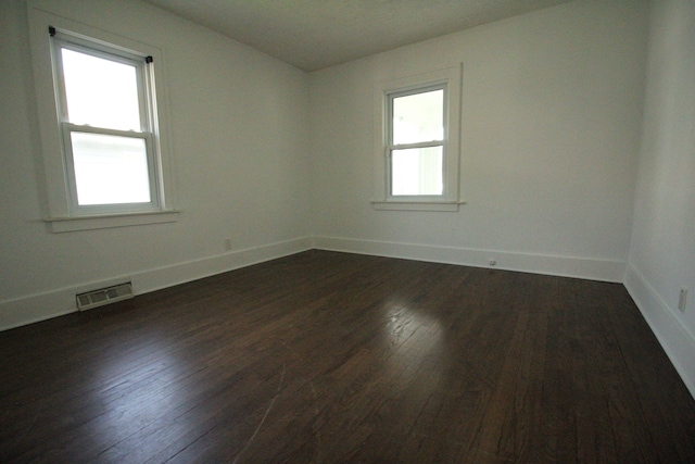 1068 La Salle Ave, Waterford, MI 48328 - unfurnished room featuring visible vents, dark wood-style flooring, and baseboards