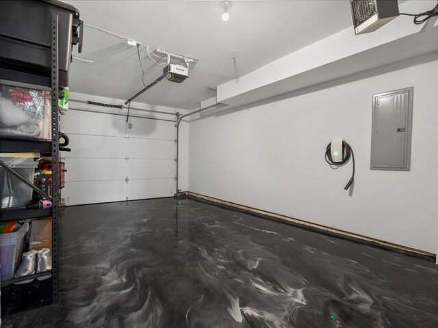 garage featuring a garage door opener and electric panel