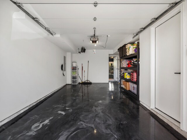 garage featuring a garage door opener and electric panel