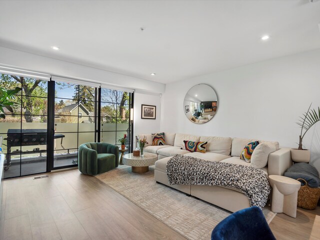 living room featuring recessed lighting and wood finished floors