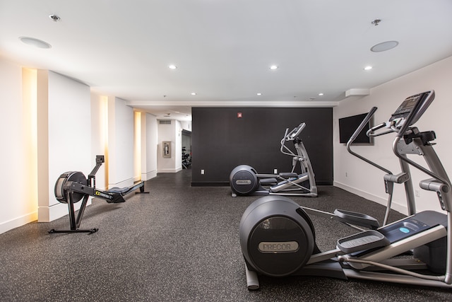 exercise room featuring recessed lighting and baseboards