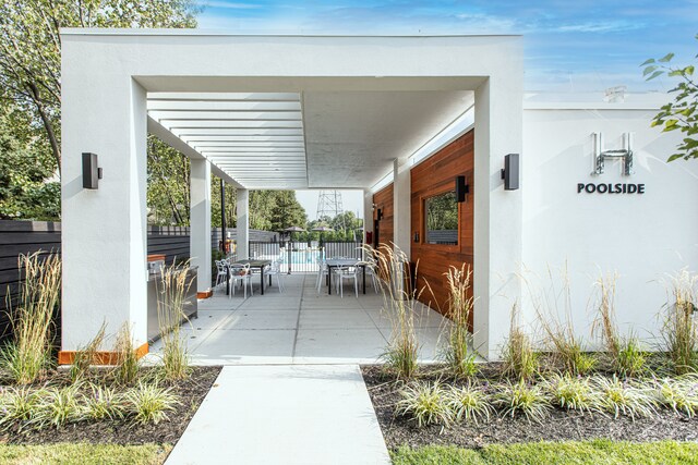view of patio with fence and outdoor dining space
