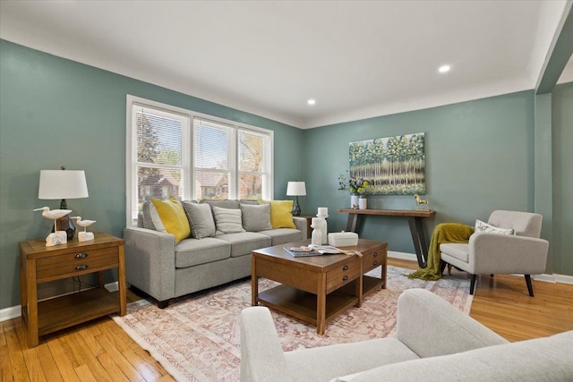 living area featuring baseboards, recessed lighting, and wood finished floors