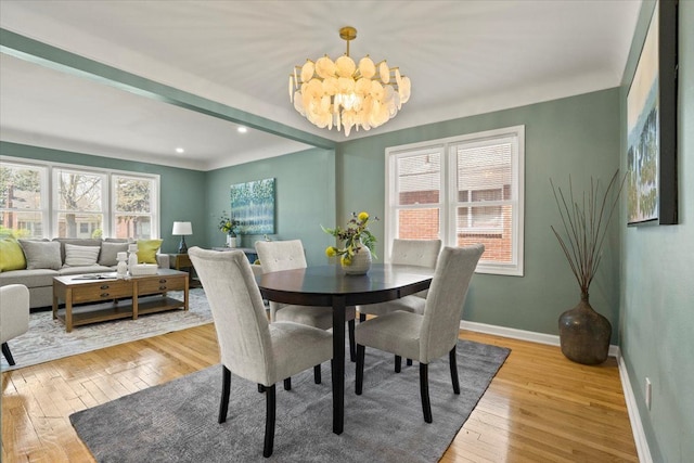 dining room featuring an inviting chandelier, recessed lighting, baseboards, and light wood-style floors