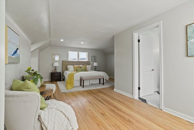 bedroom with wood-type flooring, recessed lighting, baseboards, and vaulted ceiling