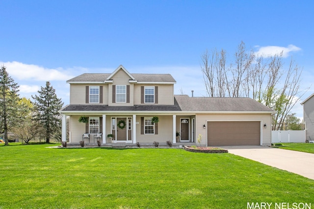 view of front of home featuring fence, a front yard, concrete driveway, an attached garage, and a porch