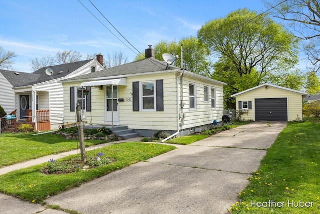 view of front of house featuring a front lawn, a detached garage, a chimney, an outdoor structure, and driveway