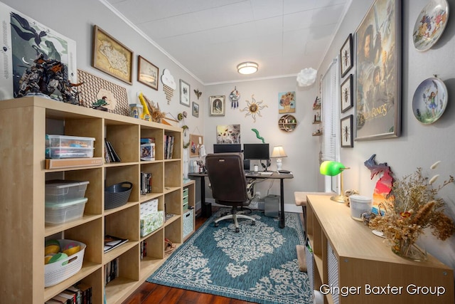 office space with baseboards, ornamental molding, and wood finished floors