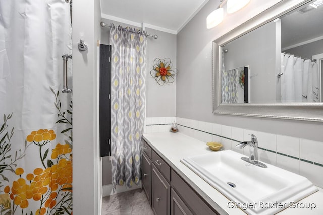 bathroom featuring visible vents, ornamental molding, and vanity