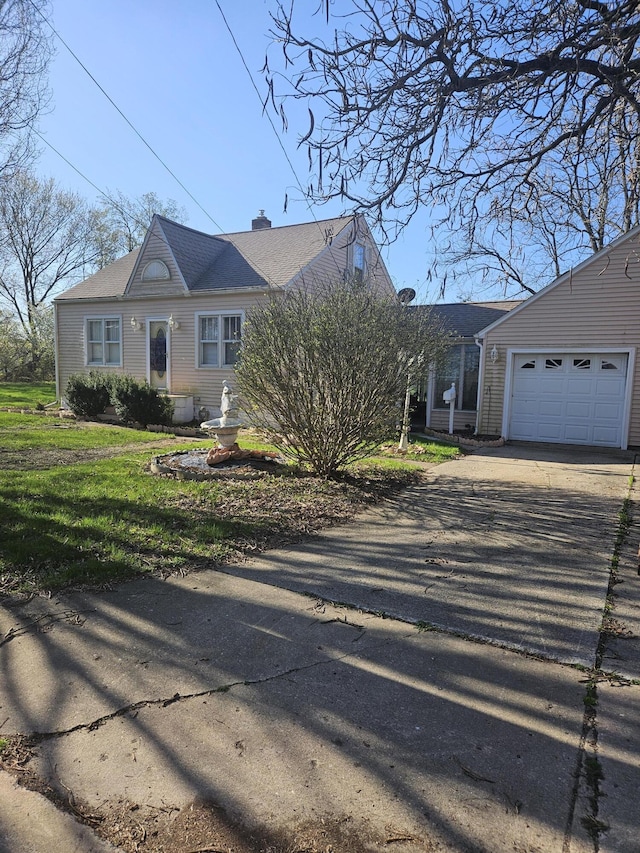 single story home with a garage, a chimney, driveway, and a front lawn