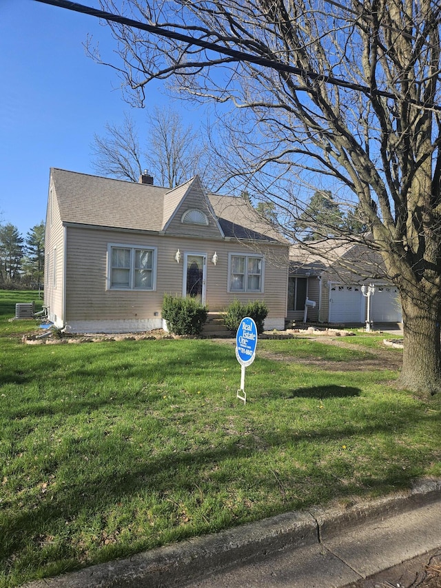 single story home featuring an attached garage, a chimney, roof with shingles, and a front lawn