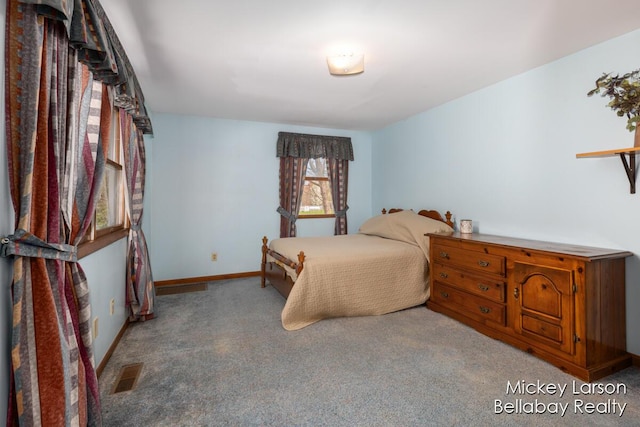 carpeted bedroom with baseboards and visible vents