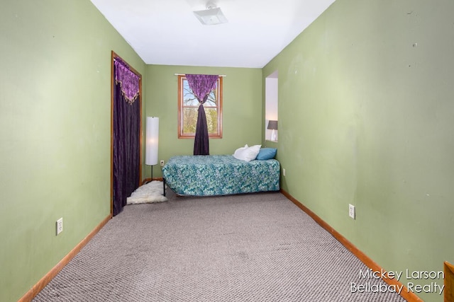 carpeted bedroom with baseboards
