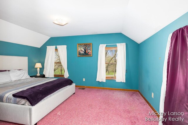 carpeted bedroom with baseboards, visible vents, and lofted ceiling
