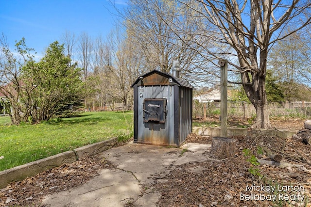 view of shed with fence