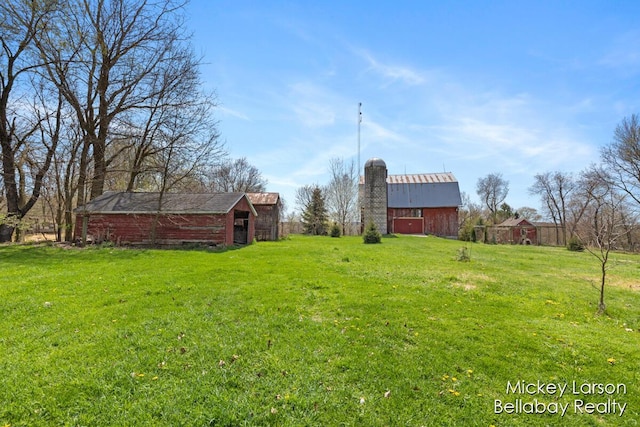 view of yard featuring a barn and an outdoor structure