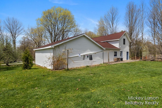 view of home's exterior with a lawn