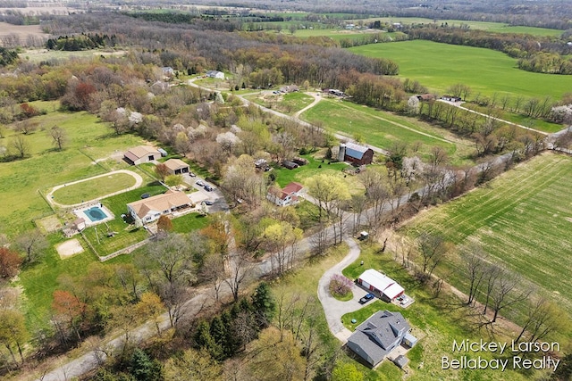 birds eye view of property with a rural view